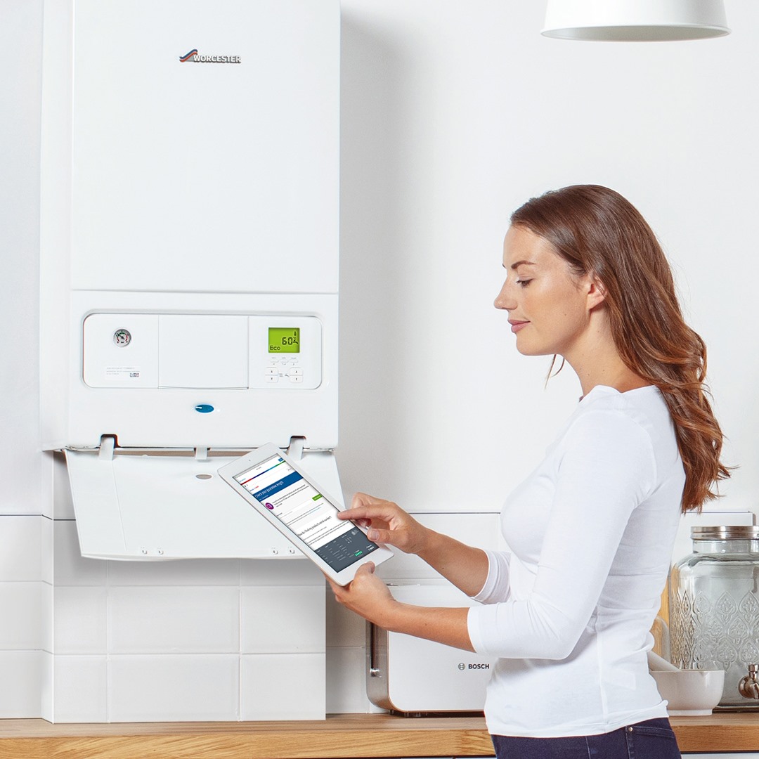 woman checking boiler system