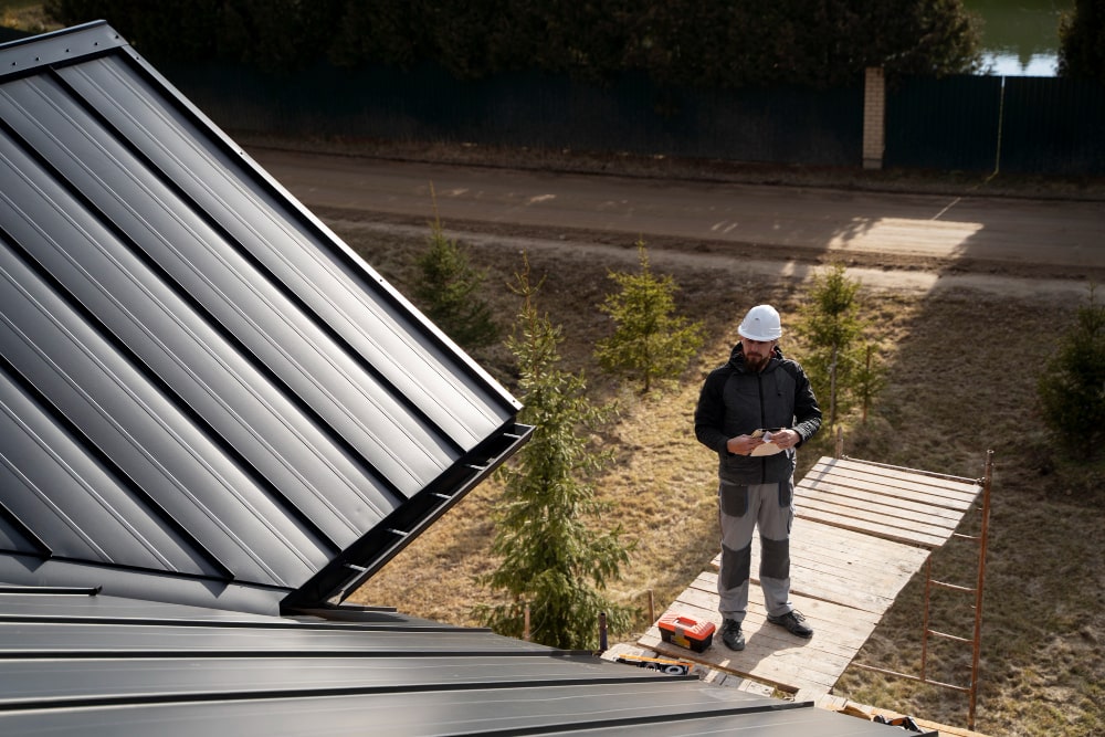 man installing solar heating system